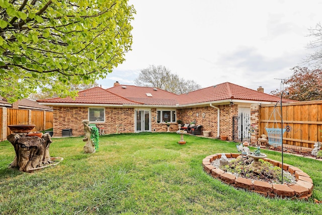 3508 Reeder Dr, Amarillo, TX 79121 - back of property featuring a yard, fence, and a tile roof