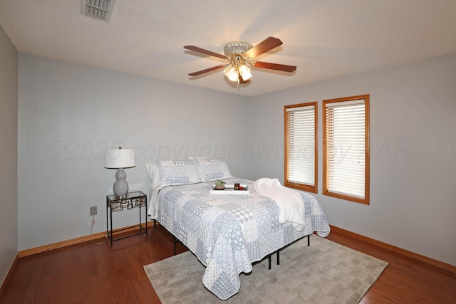 3508 Reeder Dr, Amarillo, TX 79121 - bedroom with visible vents, baseboards, ceiling fan, and wood finished floors