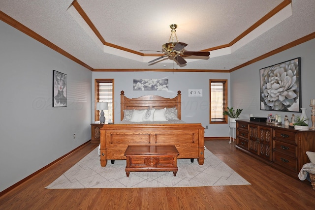 3508 Reeder Dr, Amarillo, TX 79121 - bedroom with a tray ceiling, wood finished floors, and ornamental molding