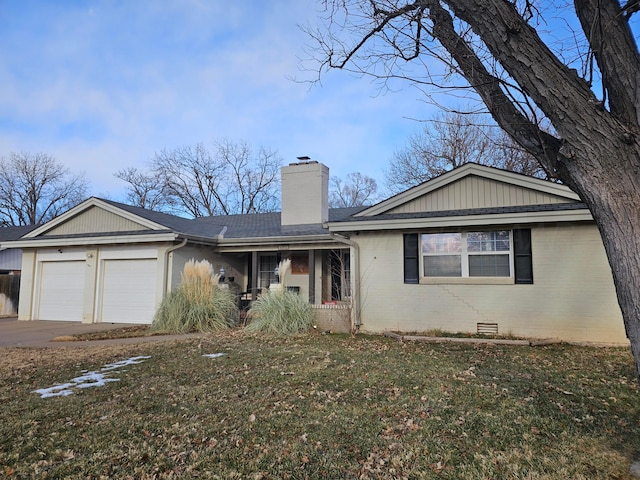 ranch-style home featuring a garage and a front lawn