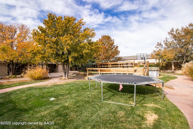 view of yard with a trampoline