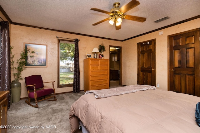 bedroom with ornamental molding, carpet floors, a textured ceiling, and ceiling fan