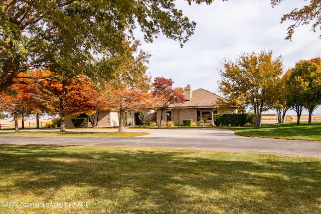 view of front of property with a front lawn