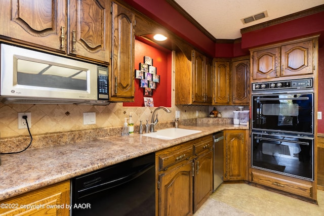 kitchen featuring backsplash, sink, and black appliances