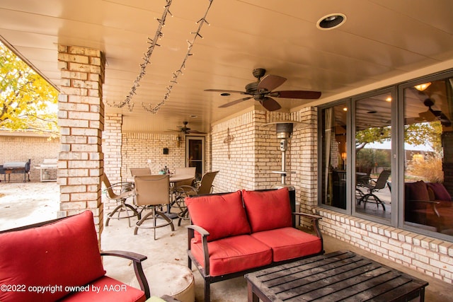 view of patio / terrace with an outdoor living space and ceiling fan