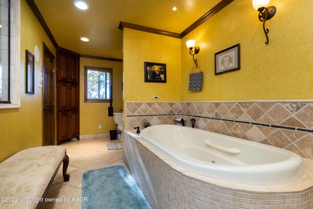 bathroom featuring a relaxing tiled tub, tile patterned floors, ornamental molding, and toilet