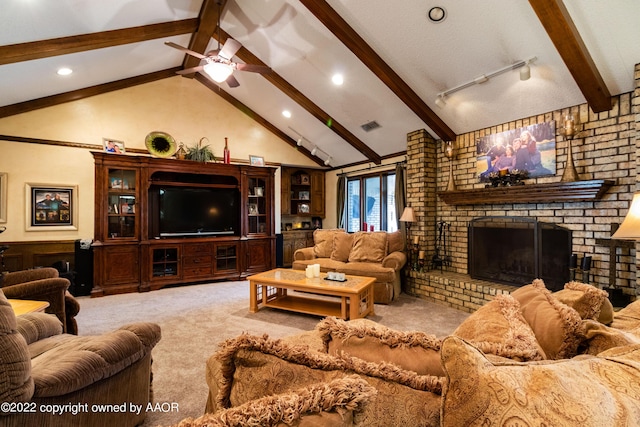 living room featuring lofted ceiling with beams, a brick fireplace, light colored carpet, and ceiling fan