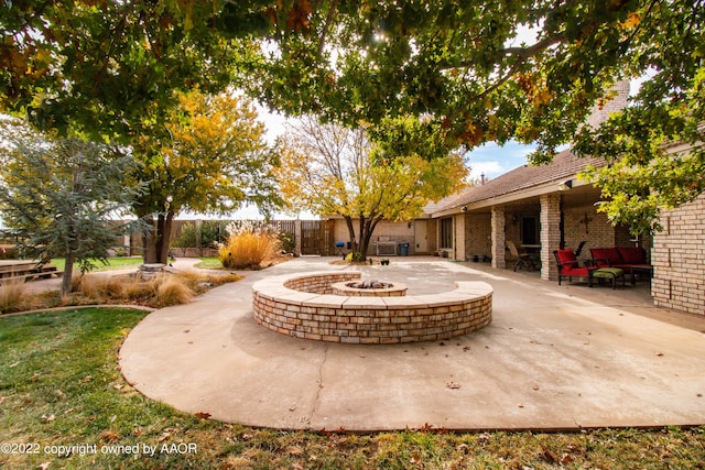 view of patio featuring an outdoor fire pit