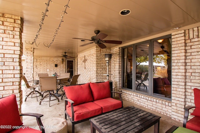 view of patio featuring an outdoor living space and ceiling fan