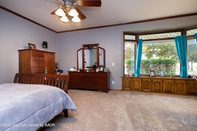 carpeted bedroom with crown molding, a textured ceiling, and ceiling fan