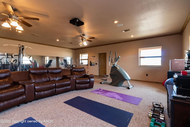 interior space with ornamental molding, carpet, and ceiling fan