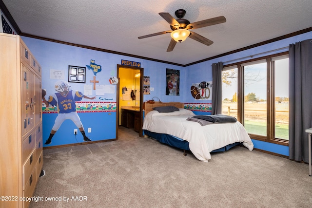 carpeted bedroom with crown molding, a textured ceiling, ceiling fan, and ensuite bath