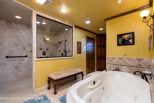 bathroom with crown molding, plus walk in shower, tile patterned flooring, and tile walls