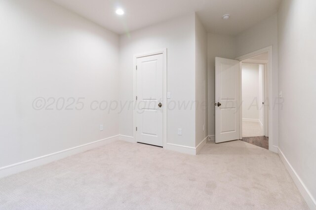8303 City View Dr, Amarillo, TX 79118 - unfurnished bedroom featuring light carpet and baseboards