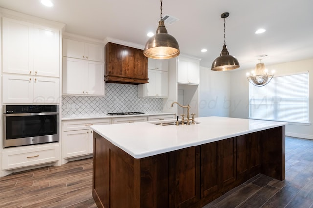 8303 City View Dr, Amarillo, TX 79118 - kitchen with stainless steel oven, a sink, dark wood-style flooring, black gas stovetop, and recessed lighting
