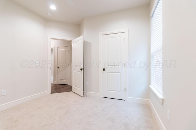 8303 City View Dr, Amarillo, TX 79118 - unfurnished bedroom with carpet flooring, multiple windows, and baseboards