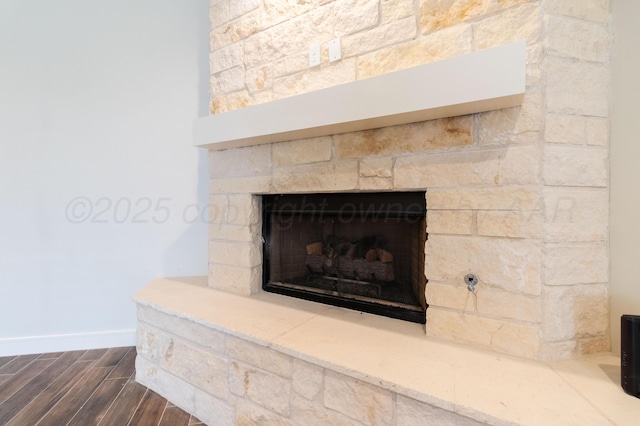 8303 City View Dr, Amarillo, TX 79118 - detailed view of a fireplace, wood finished floors, and baseboards