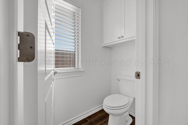 2100 Brekenridge Rd, Amarillo, TX 79124 - bathroom with wood finished floors, toilet, and baseboards