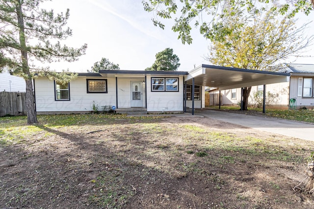 single story home featuring a carport