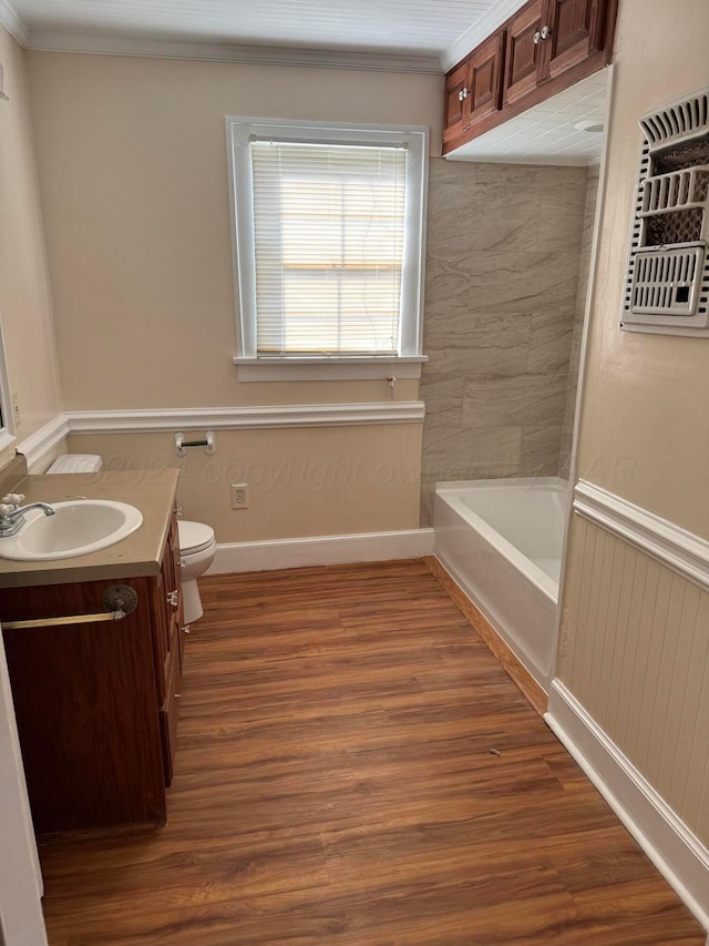 811 S Palo Duro St, Amarillo, TX 79106 - full bath featuring vanity, wood finished floors, a tub, and crown molding