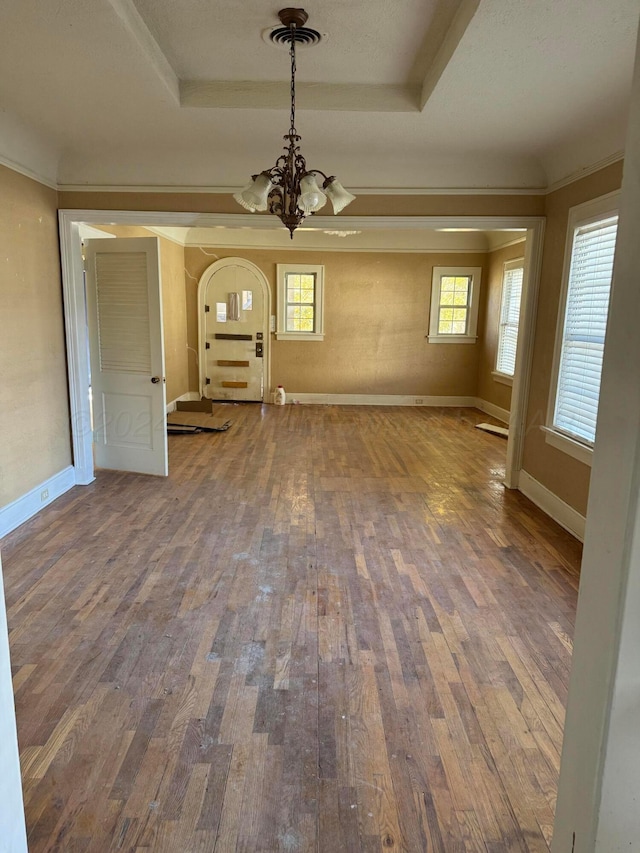 811 S Palo Duro St, Amarillo, TX 79106 - spare room with a chandelier, hardwood / wood-style floors, and a raised ceiling