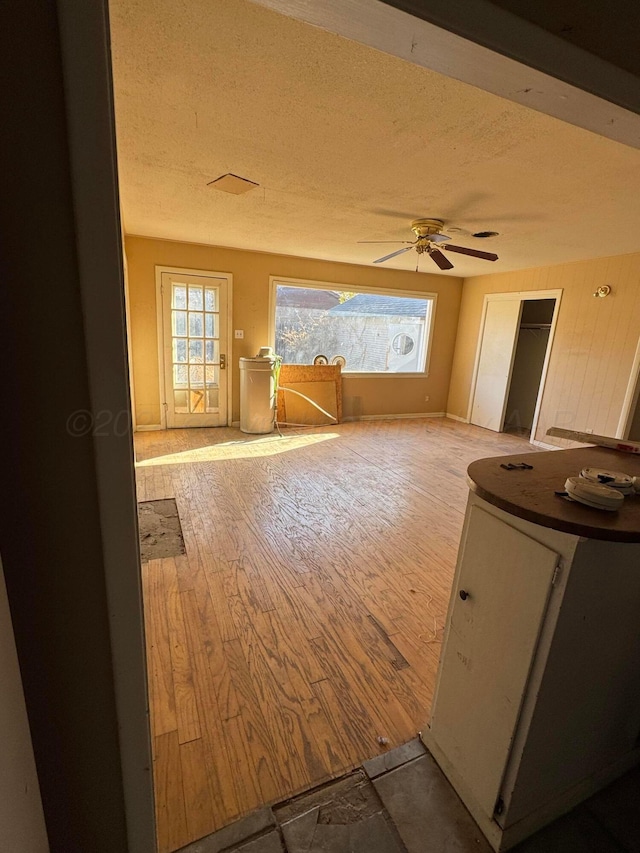 811 S Palo Duro St, Amarillo, TX 79106 - empty room with ceiling fan, a textured ceiling, and light wood-type flooring