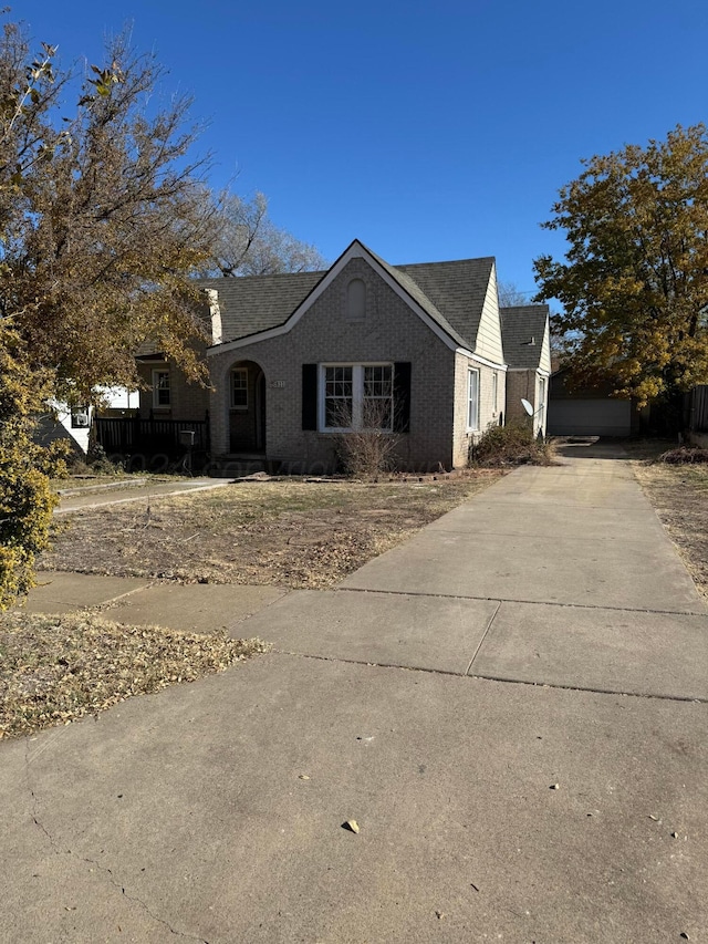 811 S Palo Duro St, Amarillo, TX 79106 - view of front facade featuring a shingled roof and brick siding