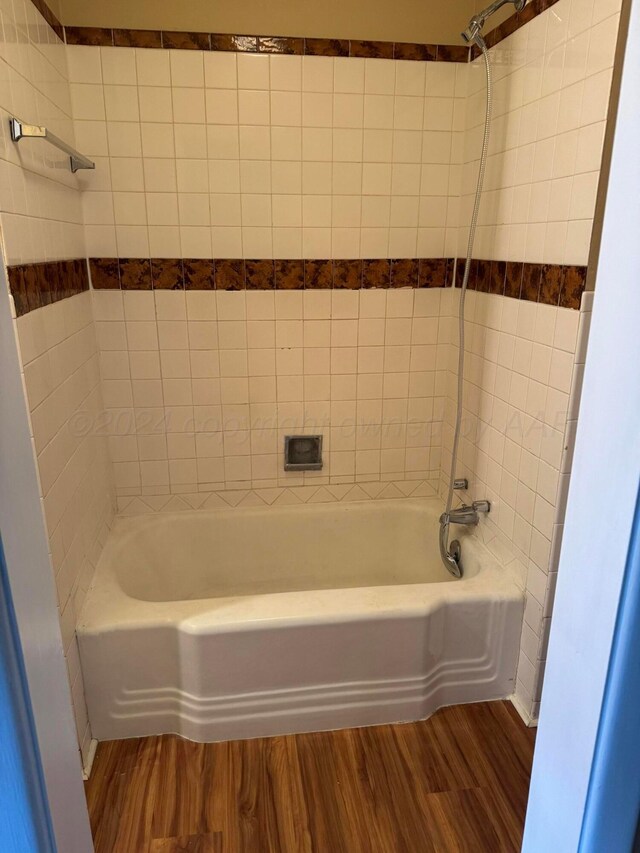 811 S Palo Duro St, Amarillo, TX 79106 - full bathroom with wood finished floors and tub / shower combination