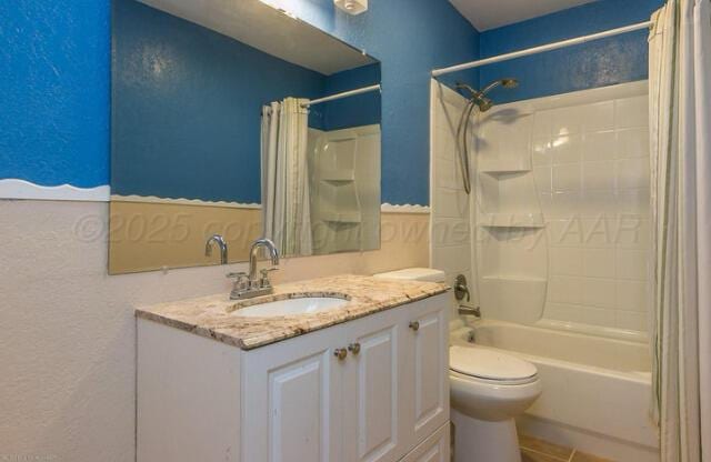 full bathroom featuring toilet, vanity, and shower / tub combo with curtain