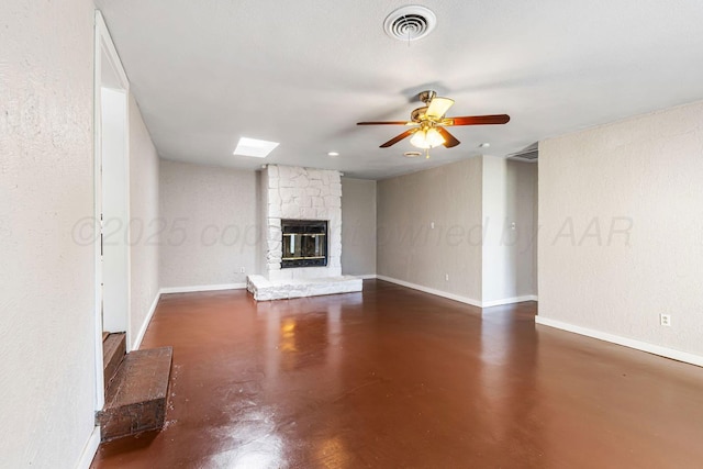 2905 S Roosevelt St, Amarillo, TX 79103 - unfurnished living room featuring finished concrete floors, a ceiling fan, and a fireplace