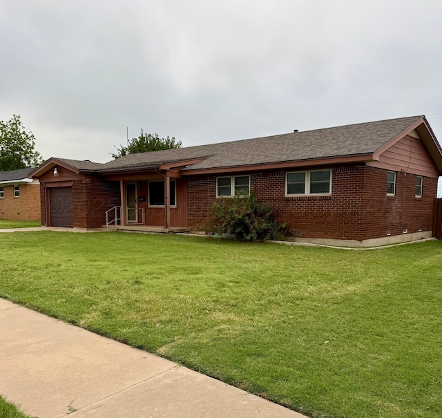 408 Jupiter St, Pampa, TX 79065 - single story home with a garage, brick siding, a front yard, a porch, and roof with shingles