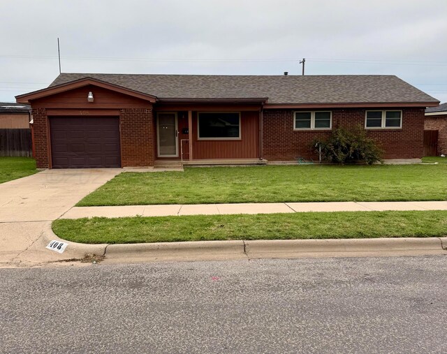 408 Jupiter St, Pampa, TX 79065 - ranch-style home featuring a garage, a front lawn, brick siding, concrete driveway, and roof with shingles