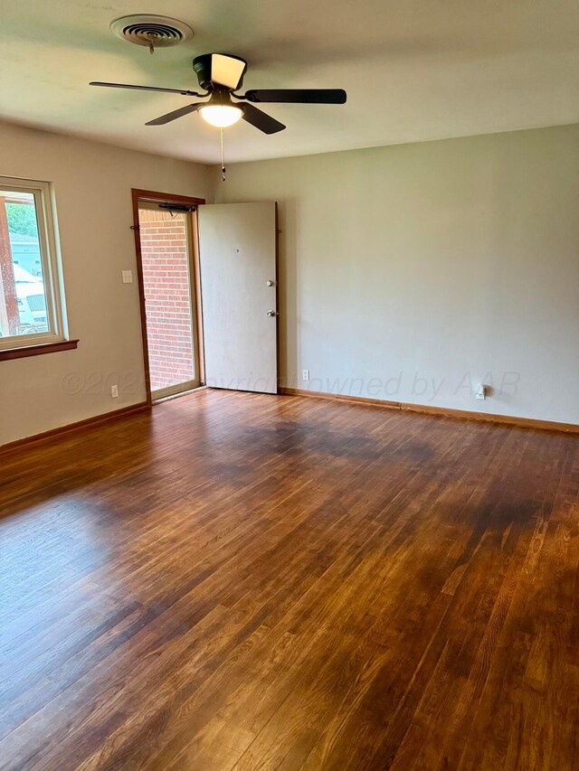 408 Jupiter St, Pampa, TX 79065 - spare room featuring wood finished floors, ceiling fan, and baseboards