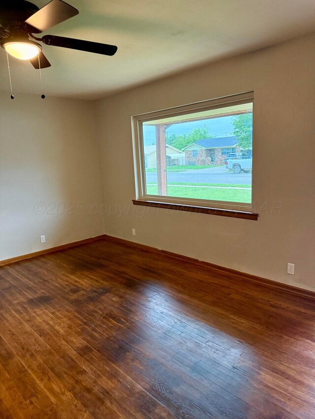408 Jupiter St, Pampa, TX 79065 - spare room with wood finished floors, baseboards, and a ceiling fan