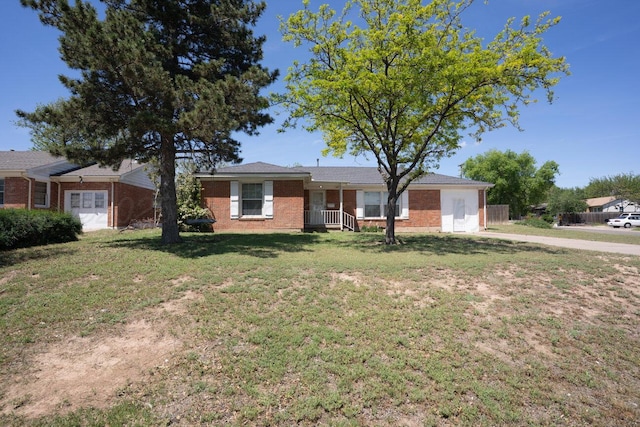 ranch-style home with brick siding and a front yard