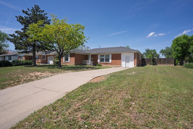 ranch-style home with brick siding and concrete driveway