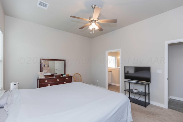1839 Montaluse Rd, Amarillo, TX 79118 - bedroom featuring light colored carpet, ceiling fan, and ensuite bath