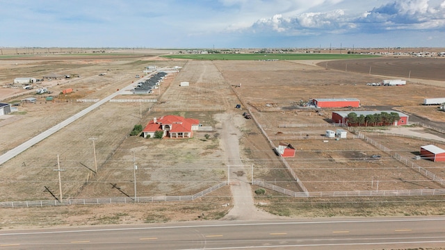 birds eye view of property featuring a rural view