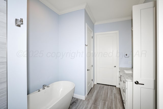 6201 Bay Rdg, Amarillo, TX 79119 - full bathroom featuring wood finished floors, a freestanding tub, ornamental molding, and vanity
