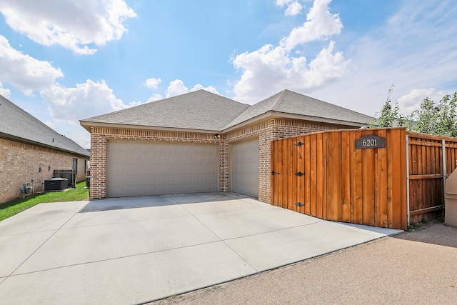 6201 Bay Rdg, Amarillo, TX 79119 - view of front of house with brick siding, a shingled roof, a garage, and concrete driveway