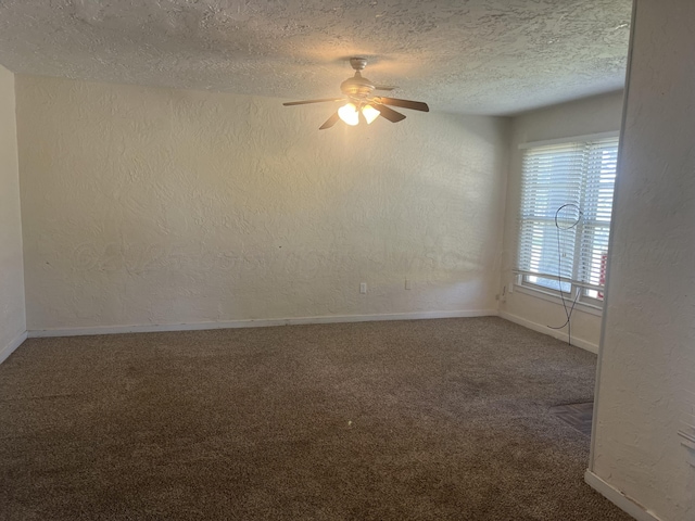 carpeted empty room with a textured ceiling and ceiling fan