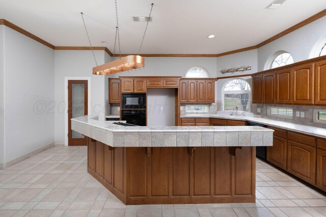 121 Quail Blvd, Amarillo, TX 79124 - kitchen with black appliances, backsplash, light tile patterned floors, ornamental molding, and recessed lighting