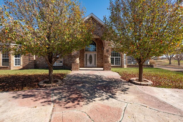 121 Quail Blvd, Amarillo, TX 79124 - view of front of house with brick siding and a front lawn