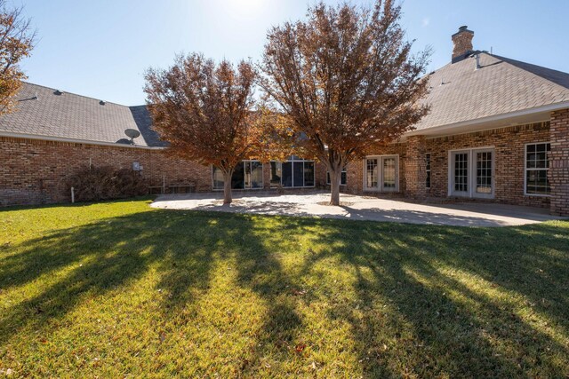 121 Quail Blvd, Amarillo, TX 79124 - back of house with french doors, a patio, and a lawn