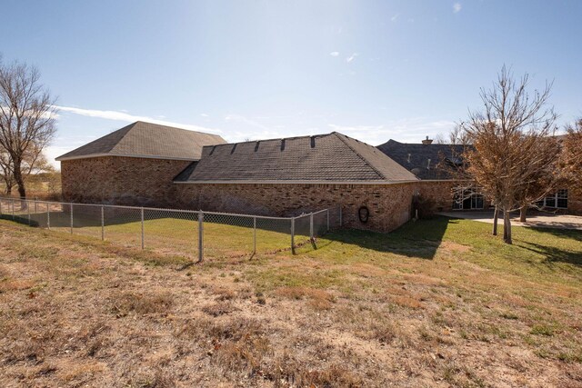 121 Quail Blvd, Amarillo, TX 79124 - rear view of property with a chimney and brick siding