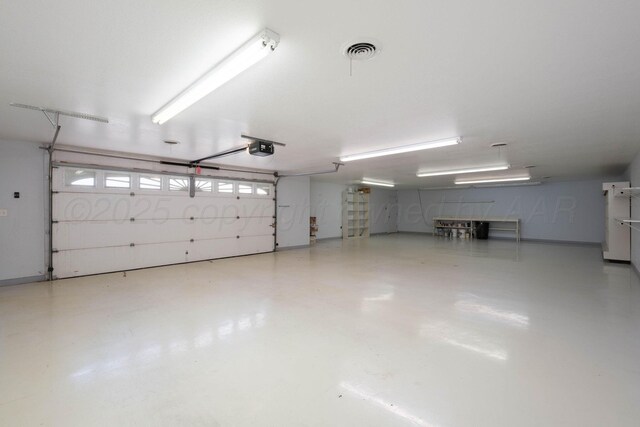 121 Quail Blvd, Amarillo, TX 79124 - garage featuring a garage door opener