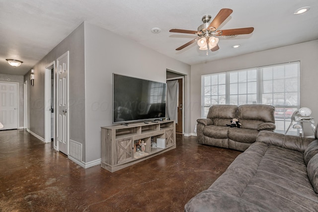 living room featuring recessed lighting, finished concrete flooring, baseboards, and ceiling fan