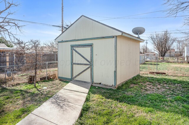 view of shed with fence