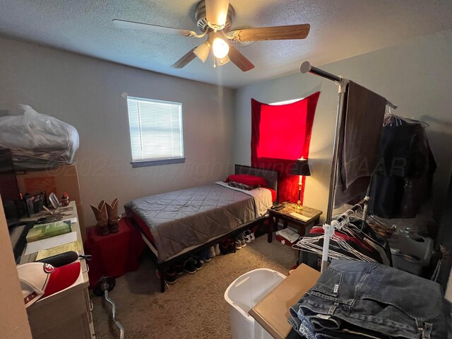 434 Long St, Hereford, TX 79045 - bedroom featuring carpet flooring, a textured ceiling, and ceiling fan