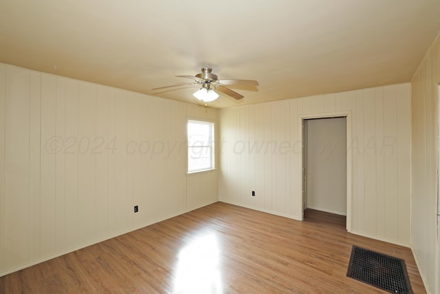 1308 Haggard St, Borger, TX 79007 - unfurnished room with baseboards, ceiling fan, light wood finished floors, and visible vents